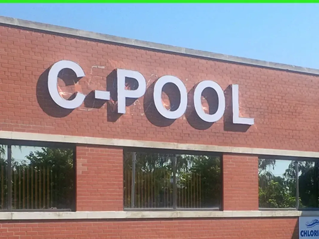 Front lit channel letters on brick building facade