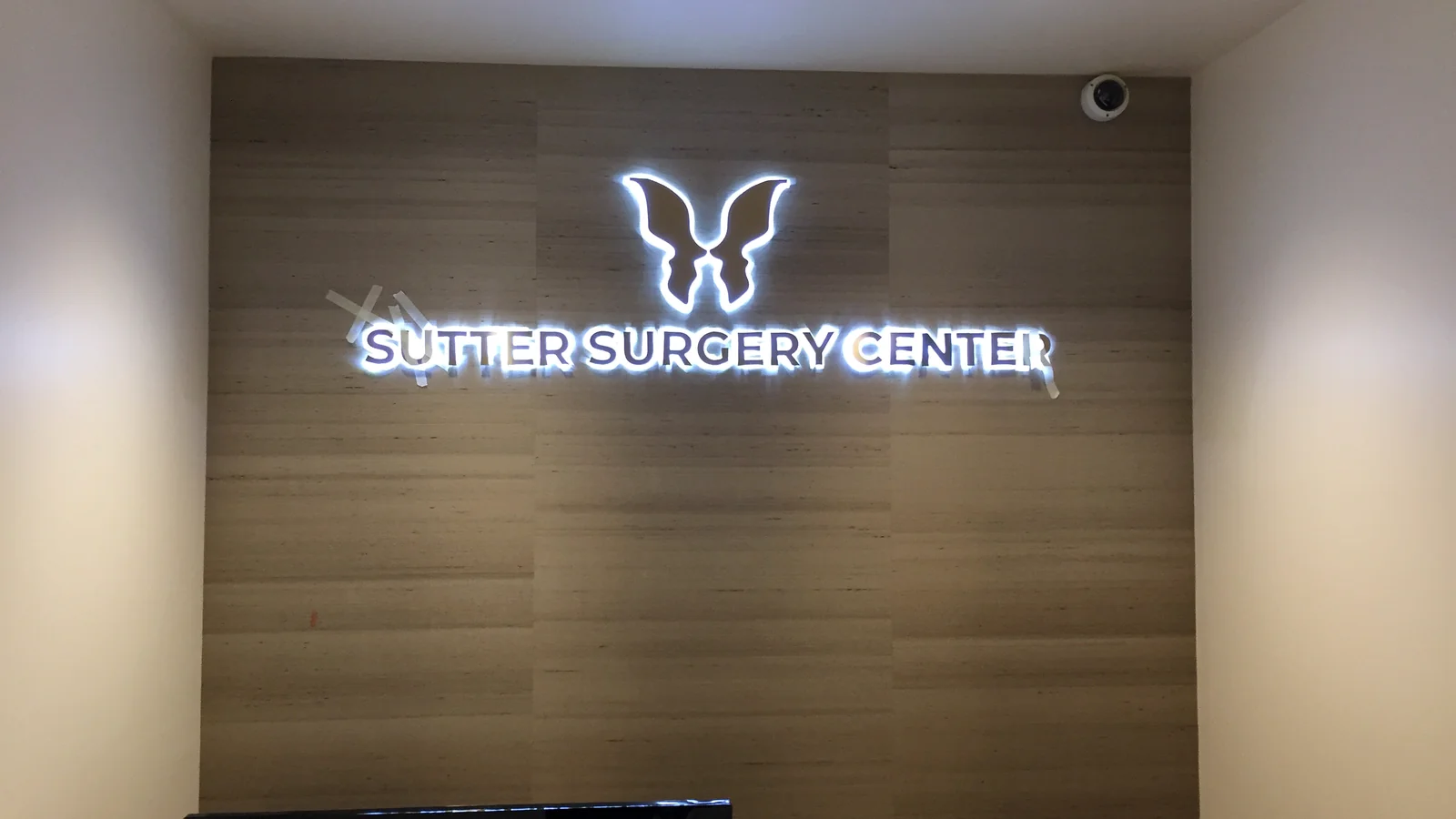 Backlit logo sign for reception desk