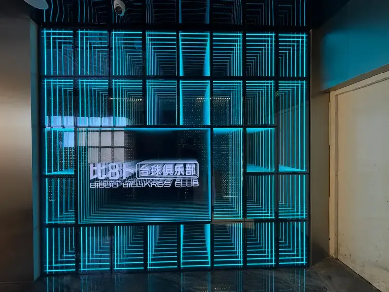 Blue infinity mirror feature wall for club and entertainment venue