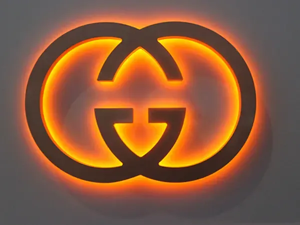 Small reverse channel letters on cafe awning at dusk