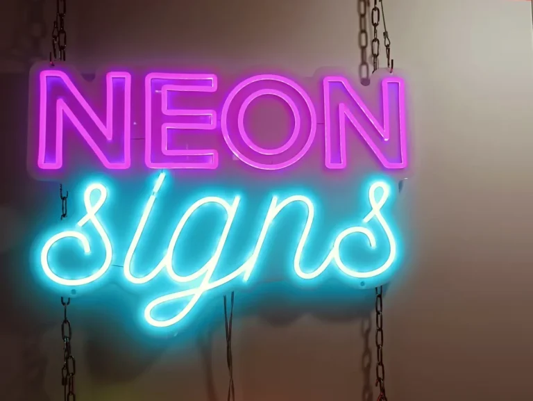Purple outlined block letters above cyan script lettering on suspended clear backing.