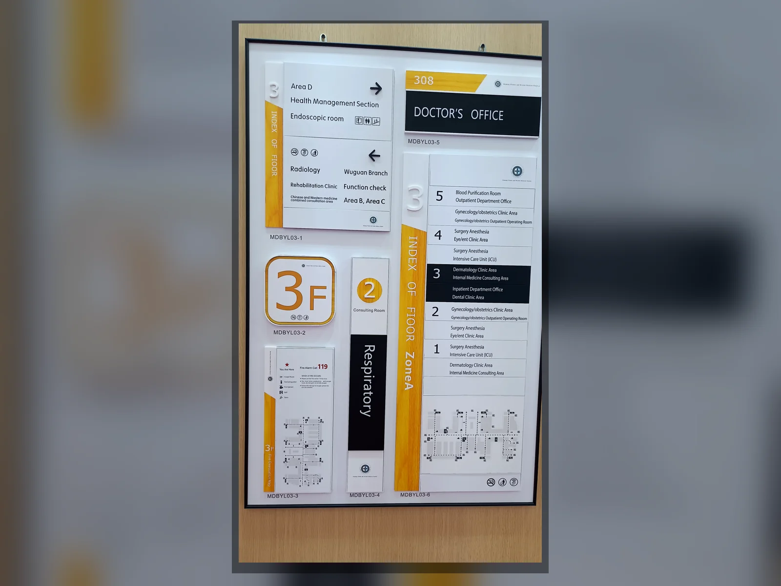 A display board with floor numbers, arrows, destinations and directory sign samples.