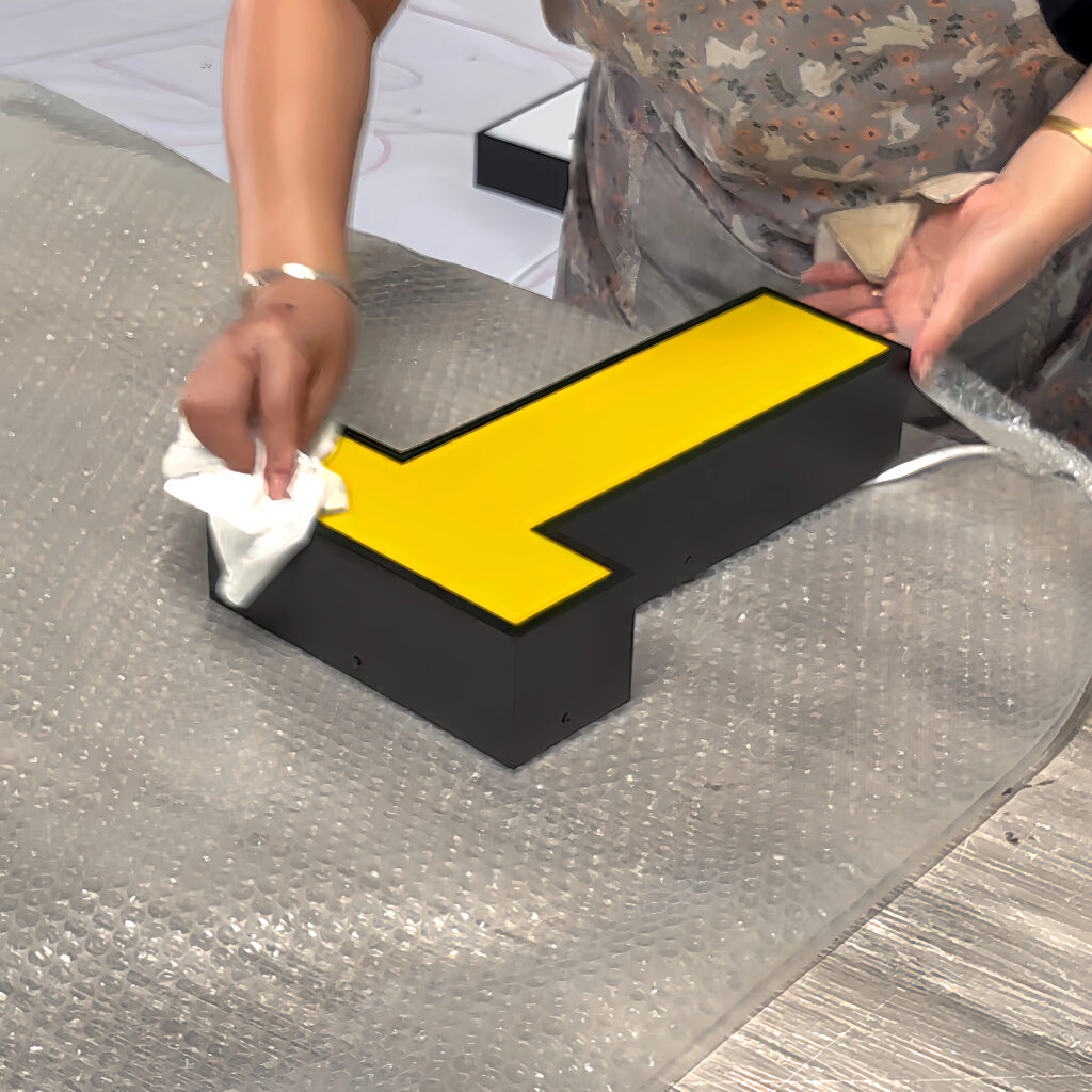 Cleaning the finished sign surface before final packing