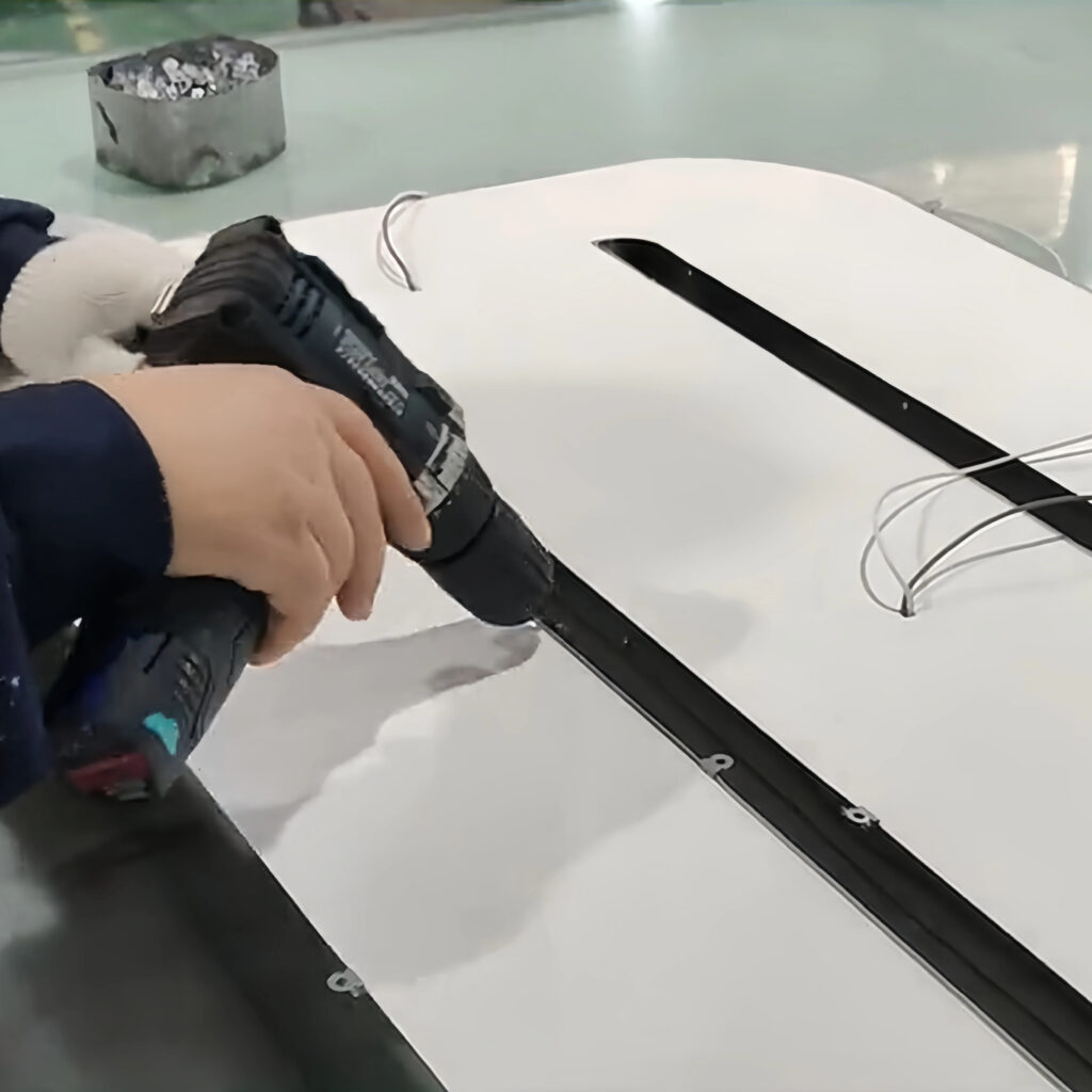 Assembling and reinforcing illuminated sign components before testing