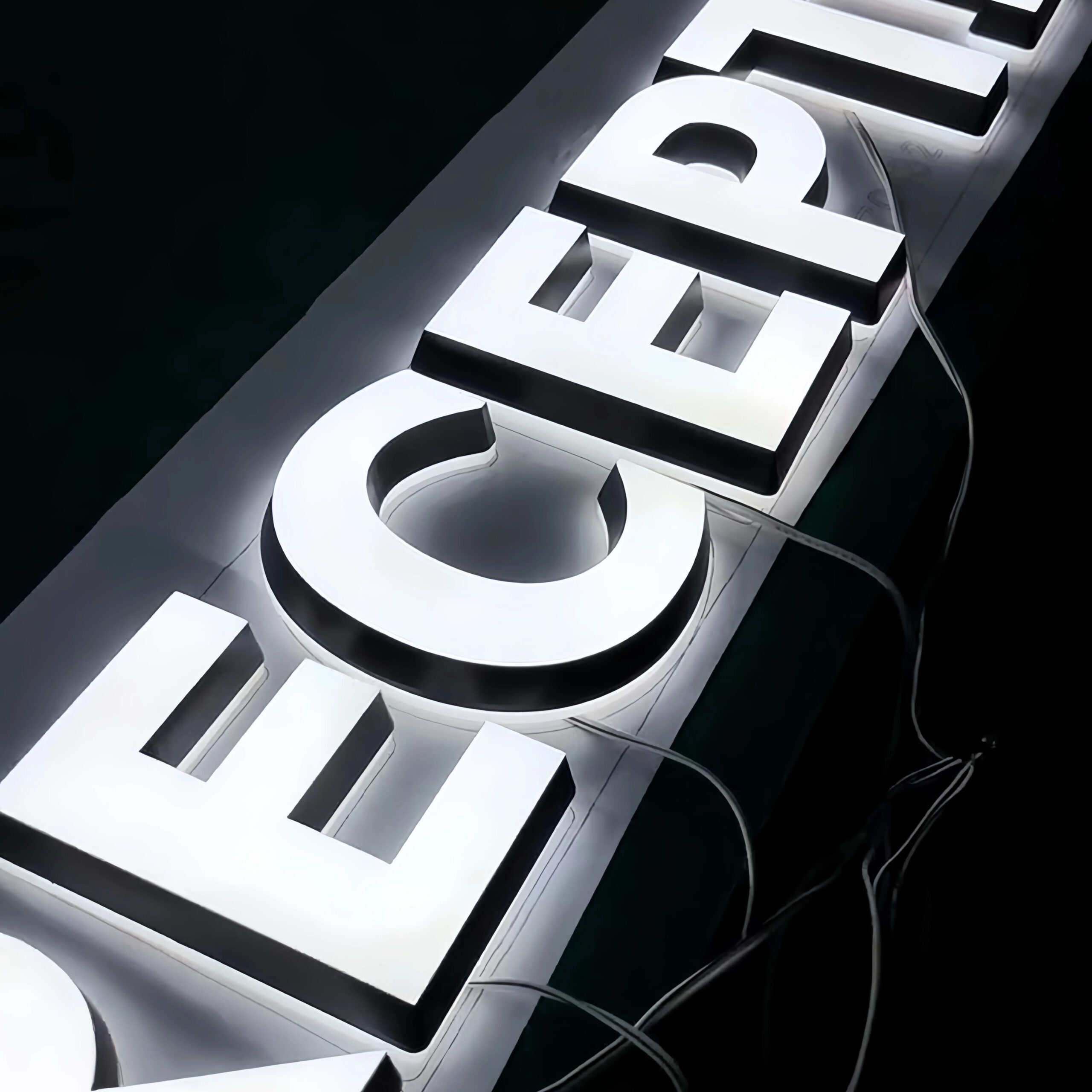 White illuminated channel letters connected for a power-on lighting check