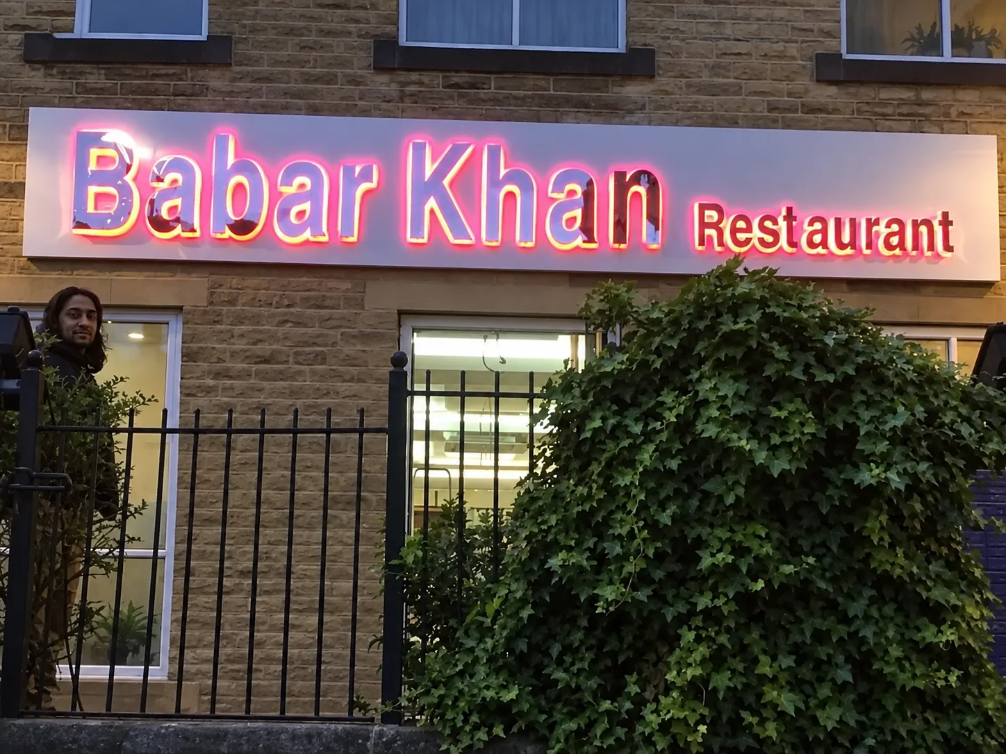 Illuminated Babar Khan restaurant storefront channel letter sign