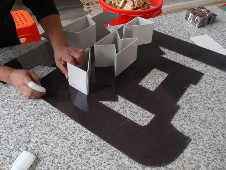 Technician assembling a dimensional channel letter shell