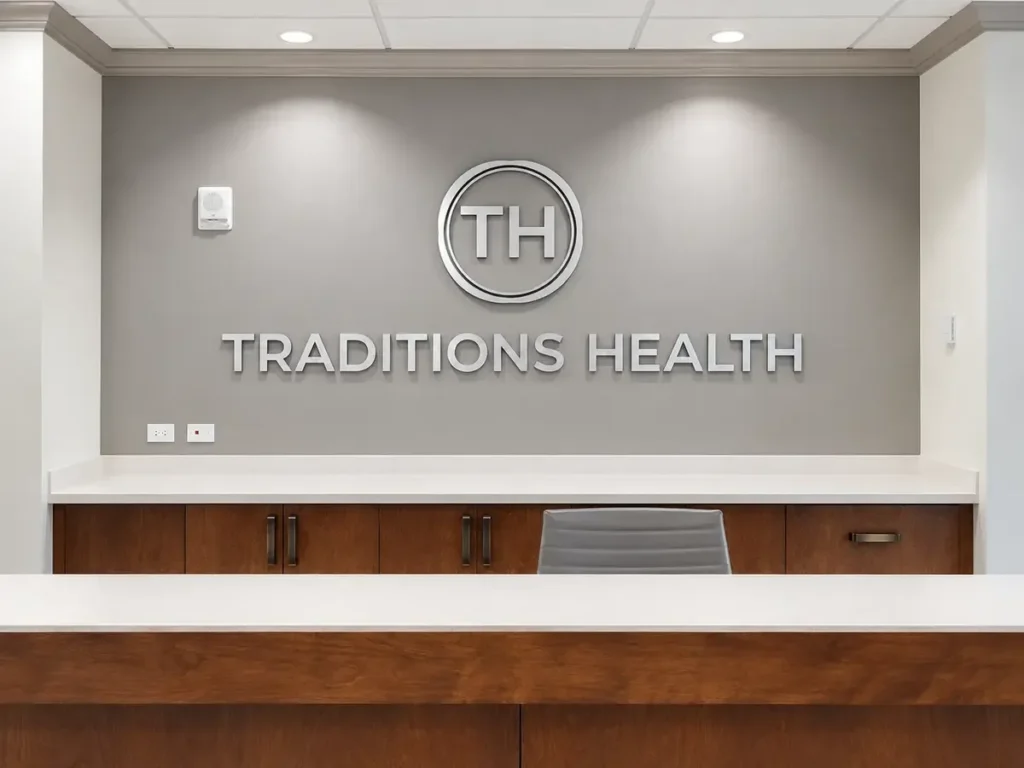 Corporate office reception signage integrated with a glass entrance and branded interior