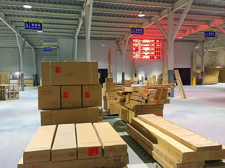 Packed cartons arranged in a covered dispatch area
