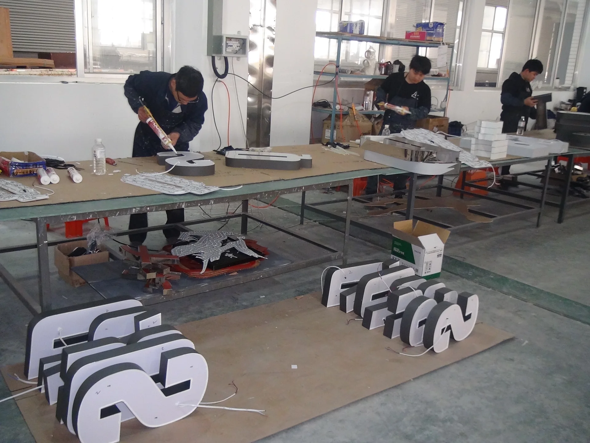 Dimensional letter sets arranged on an assembly workbench