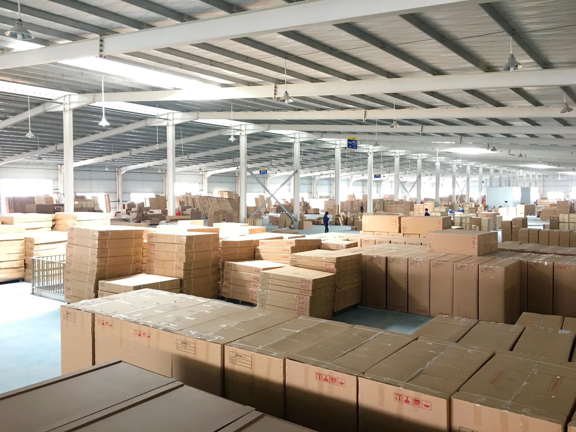 Packed cartons organized in a finished goods storage area