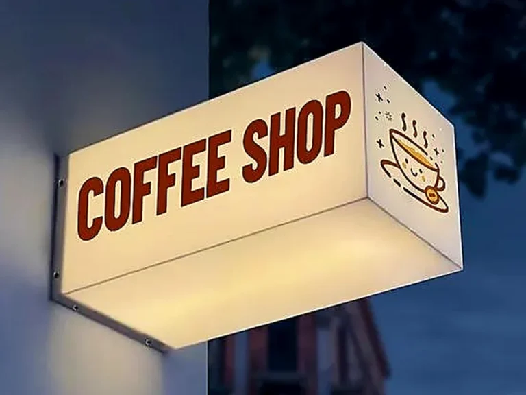 Illuminated projecting light box sign installed on a commercial storefront.
