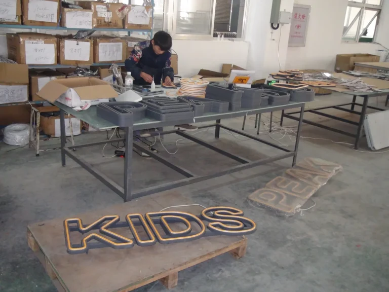 Neon flex letters and tools on an assembly table