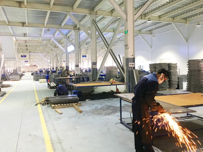 Technician grinding a metal fabricated component