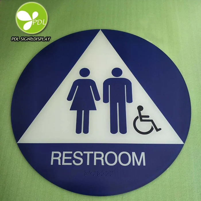 A round blue restroom sign with white facility pictograms and the word RESTROOM.