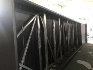 Rear view of a large sign cabinet showing diagonal internal metal support framing.